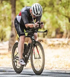 Man on a time trial bike in an ironman event