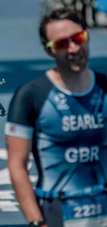 A blurry image of a triathlete at the end of a race.